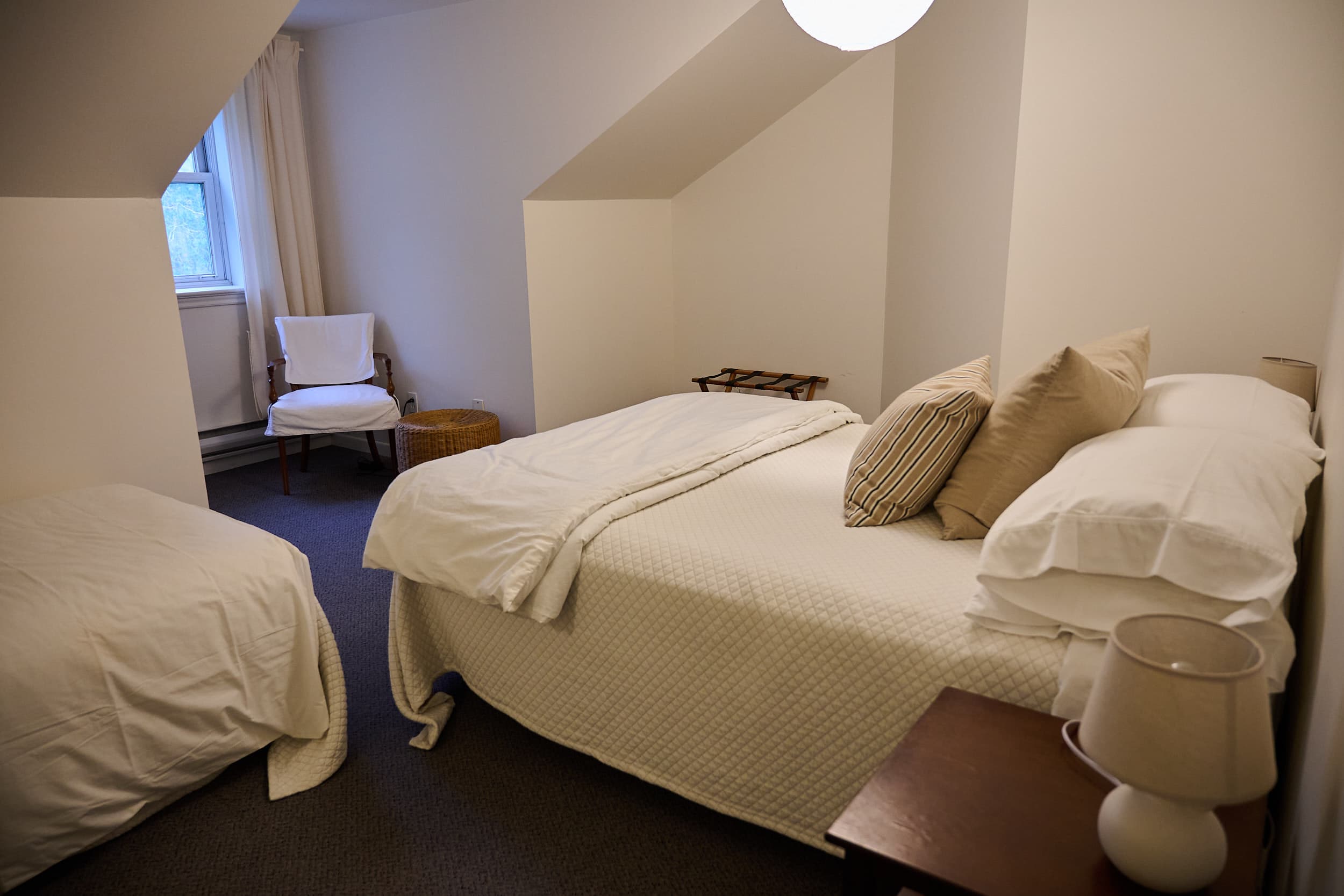 Family room with a queen bed and a single bed